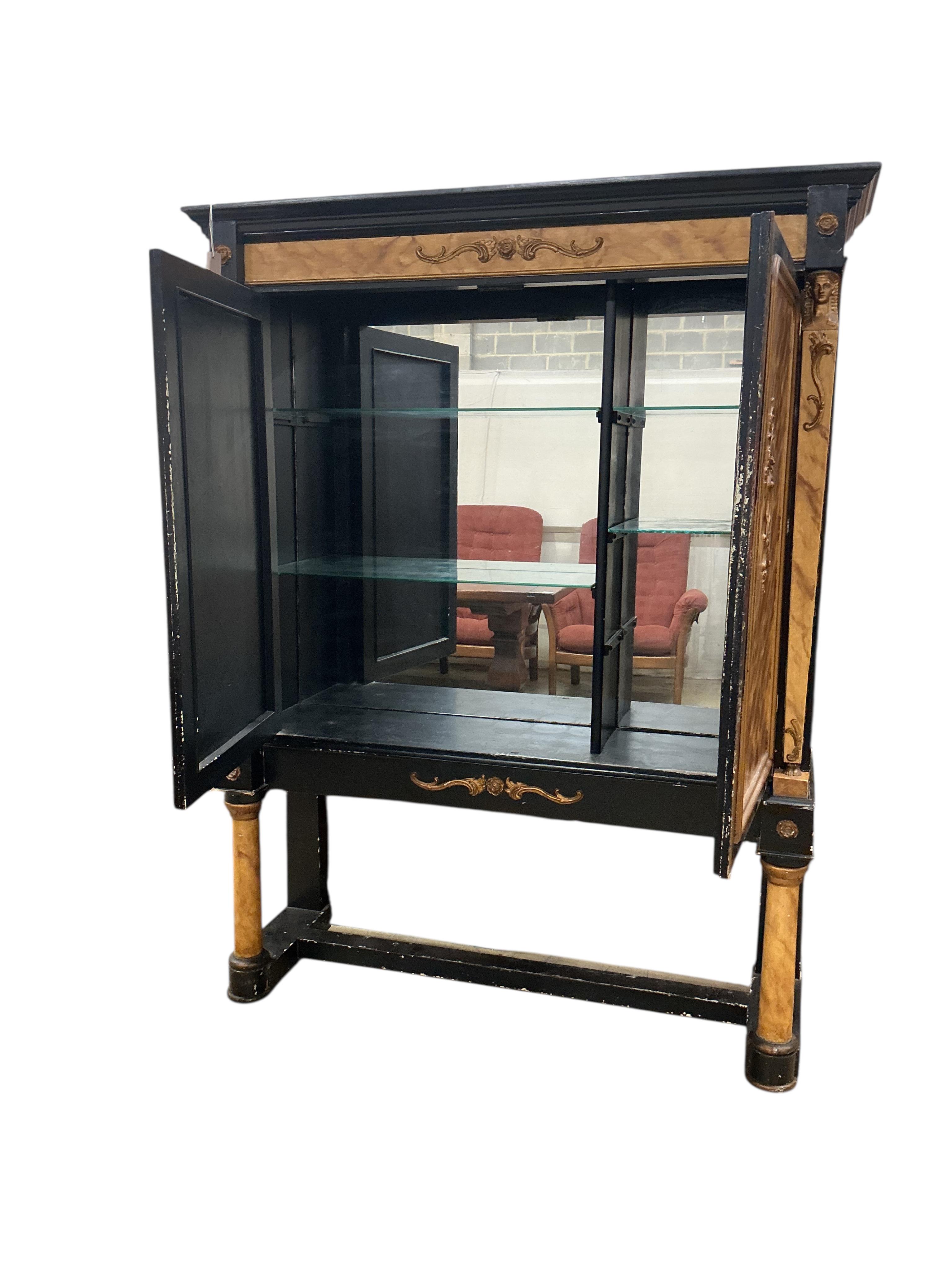 A painted Empire style faux marble two door cabinet on stand, width 140cm, depth 39cm, height 180cm